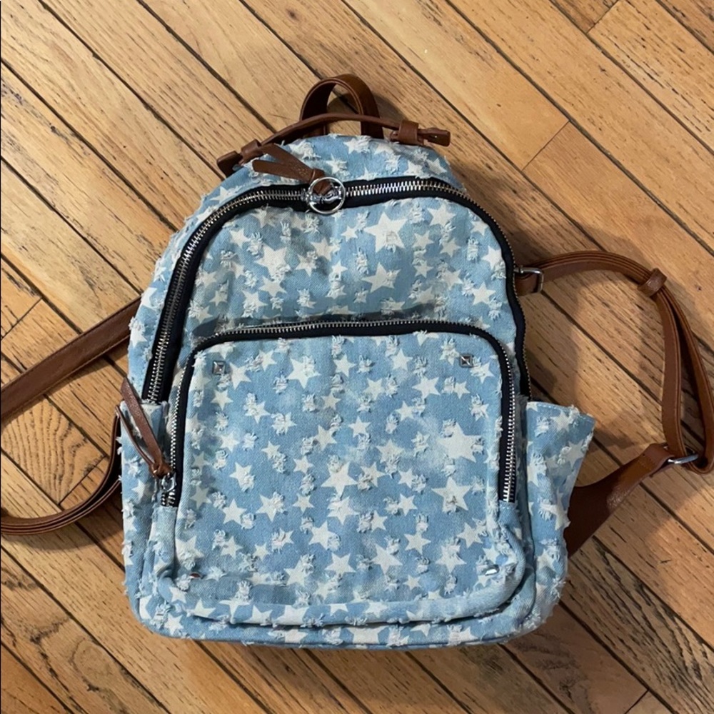 Distressed Light Wash Denim Backpack with Stars
